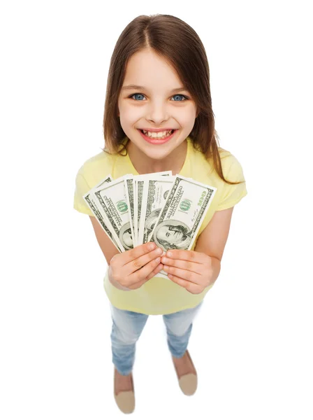 Sorridente bambina con denaro contante dollaro — Foto Stock