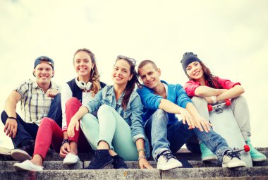 group of smiling teenagers hanging out clipart