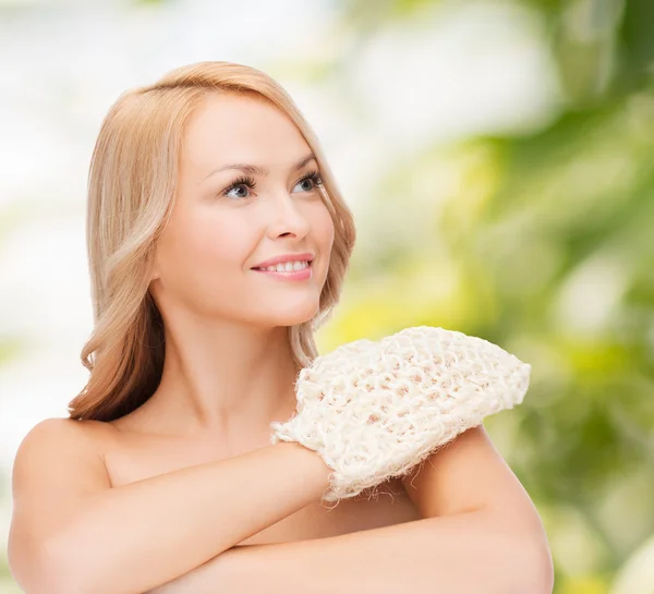 Smiling woman with exfoliation glove — Stock Photo, Image
