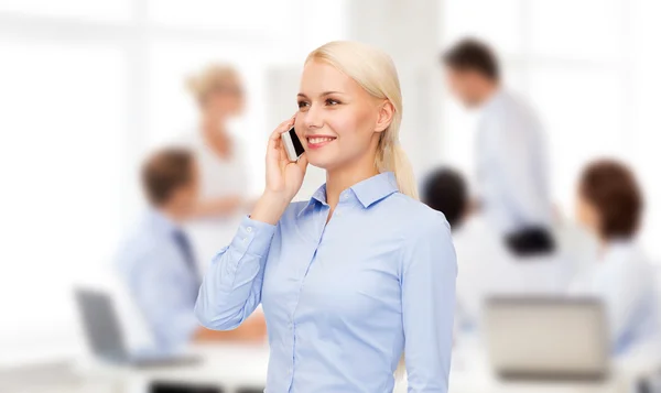 Young smiling businesswoman with smartphone — Stock Photo, Image