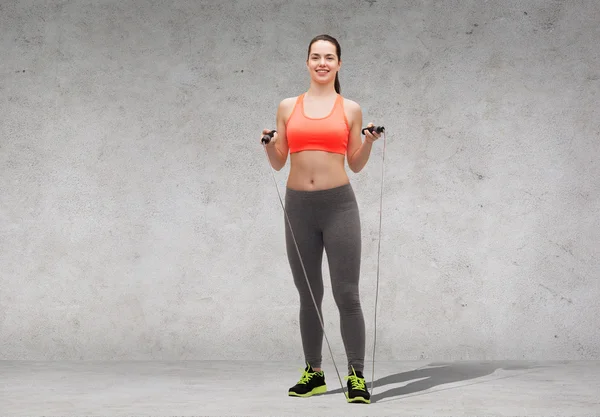 Sporty woman with skipping rope — Stock Photo, Image