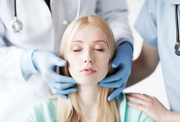 Plastic surgeon or doctor with patient — Stock Photo, Image