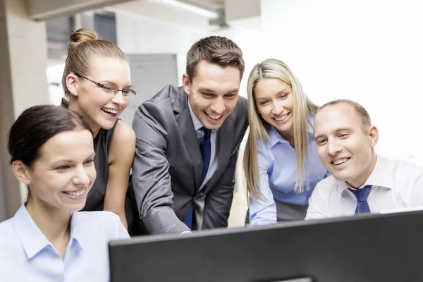 Business team with monitor having discussion — Stock Photo, Image