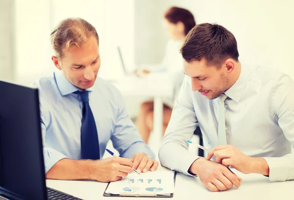 Businessmen with notebook on meeting — Stock Photo, Image