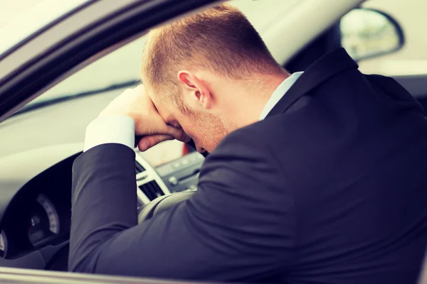 Tired businessman or taxi car driver — Stock Photo, Image