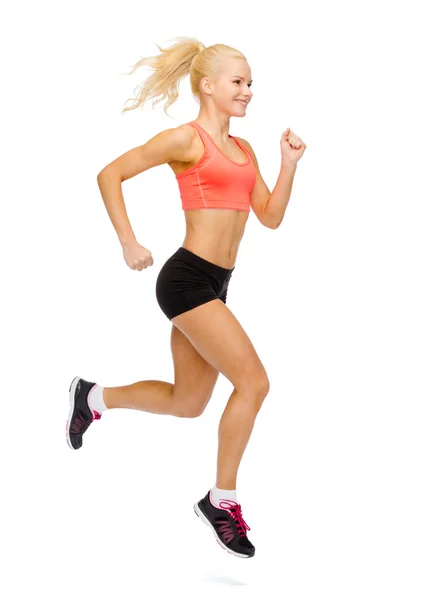 运动型女人跑或跳跃 — Stock fotografie