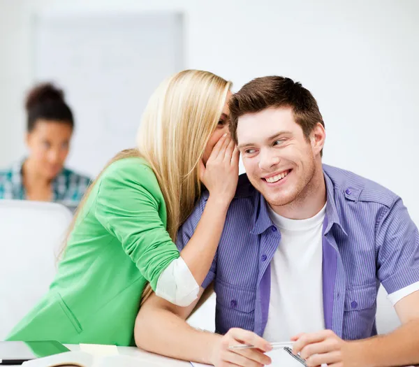 Group of students gossiping at school — Stock Photo, Image