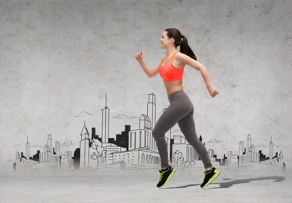 Sporty woman running in front of the city drawing — Stock Photo, Image