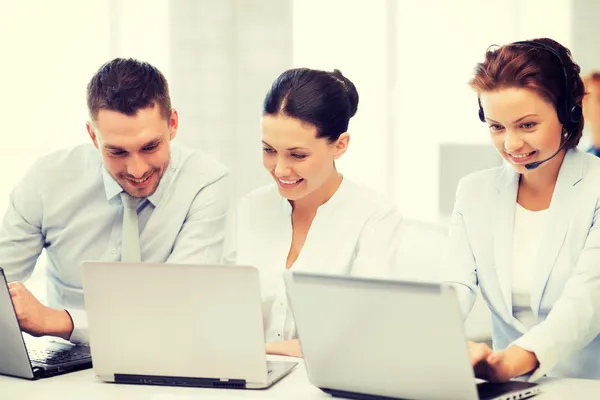 Group of people working with laptops in office — Stock Photo, Image