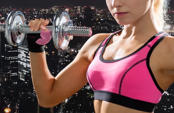 Close up of sporty woman with heavy steel dumbbell — Stock Photo, Image