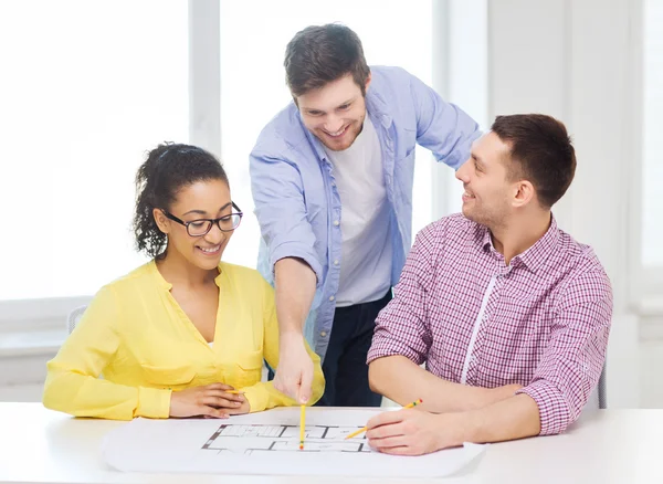 Three smiling architects working in office — Stock Photo, Image