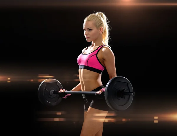 Sporty woman exercising with barbell — Stock Photo, Image