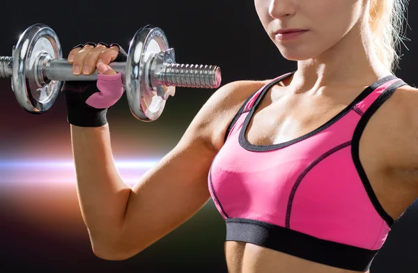 Close up of sporty woman with heavy steel dumbbell — Stock Photo, Image