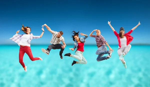 Group of teenagers jumping — Stock Photo, Image