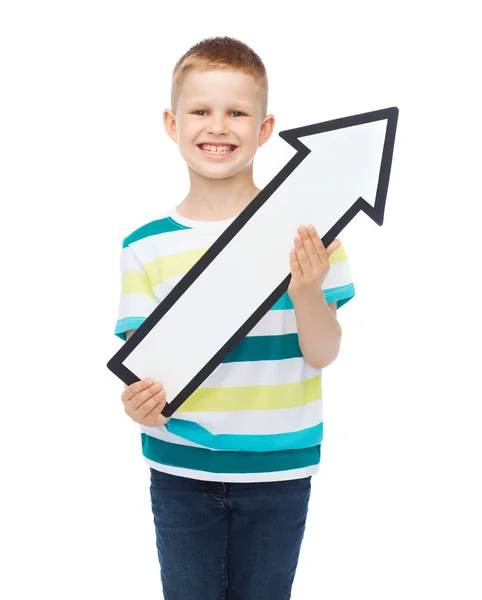 Smiling little boy with blank arrow pointing up — Stock Photo, Image