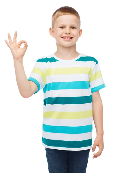 Little boy in casual clothes showing OK gesture — Stock Photo, Image