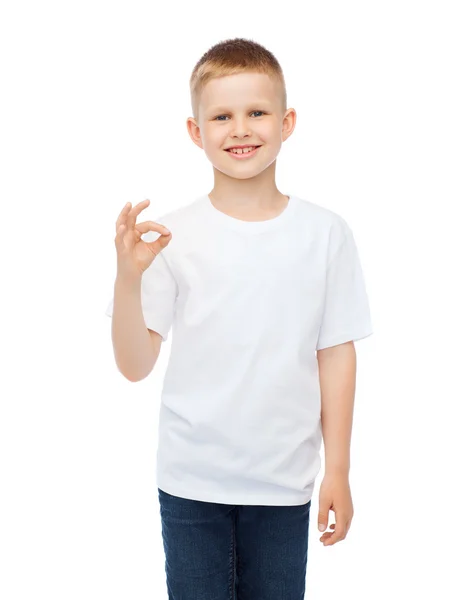 Little boy in white t-shirt showing ok gesture — Stock Photo, Image
