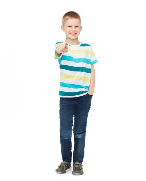 Little boy in casual clothes pointing his finger — Stock Photo, Image