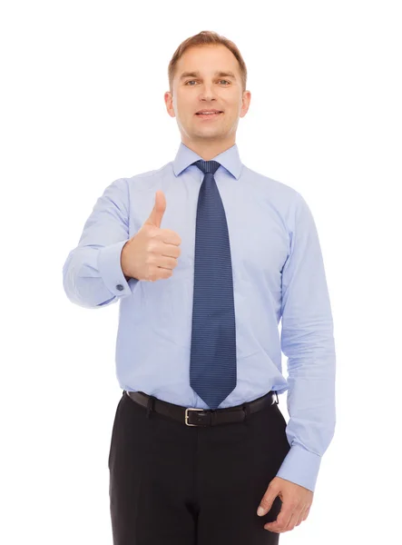 Smiling businessman showing thumbs up Stock Picture