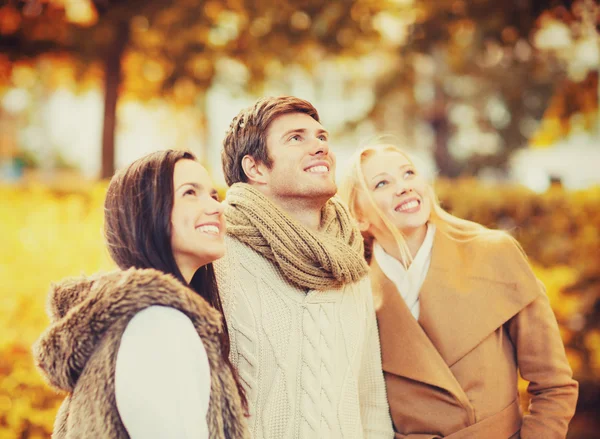 Group of friends having fun in autumn park — Stock Photo, Image