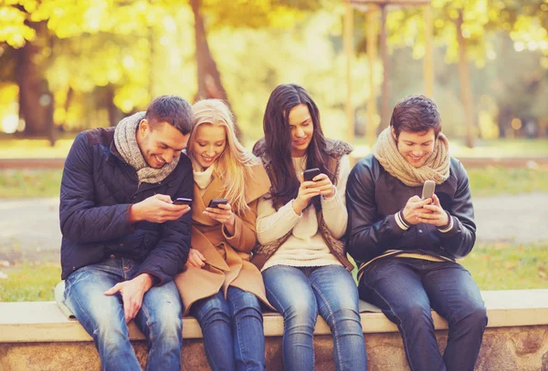 Group of friends having fun in autumn park — Stock Photo, Image