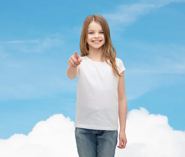 Little girl in blank white t-shirt pointing at you — Stock Photo, Image