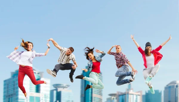 Group of teenagers jumping — Stock Photo, Image