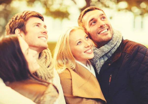 Group of friends having fun in autumn park — Stock Photo, Image