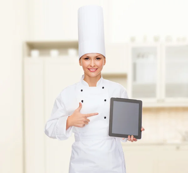 Chef femenino sonriente con pantalla en blanco tablet pc —  Fotos de Stock