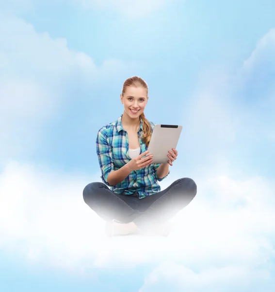 Young woman in casual clothes sitting on floor — Stock Photo, Image