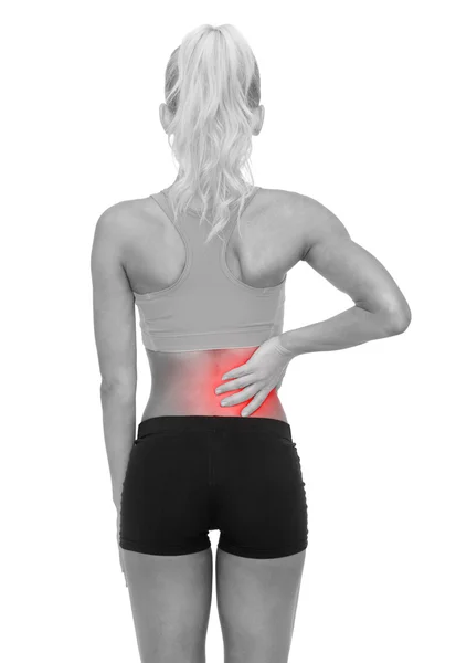 Sporty woman touching her back — Stock Photo, Image