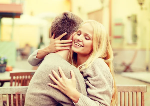 Romantic happy couple hugging in the cafe — Stock Photo, Image