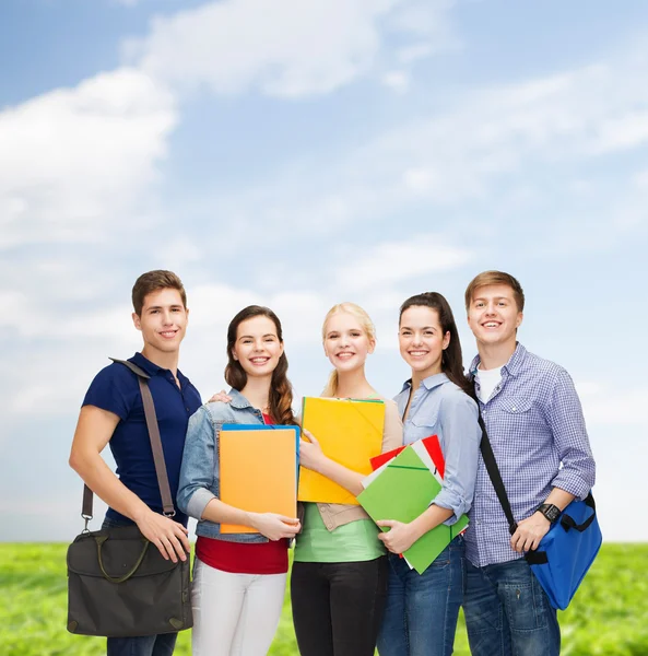 Group of smiling students standing Stock Picture