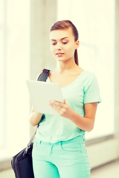 Smiling student with tablet pc in college — Stock Photo, Image
