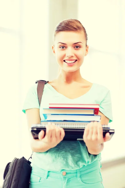 Student with folders and school bag in college — Stock Photo, Image