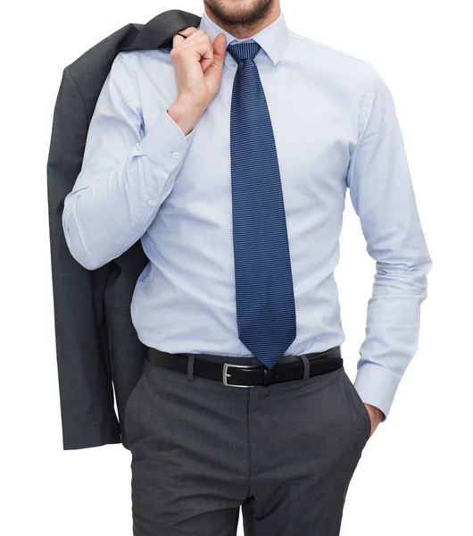 Handsome buisnessman with jacket over shoulder — Stock Photo, Image