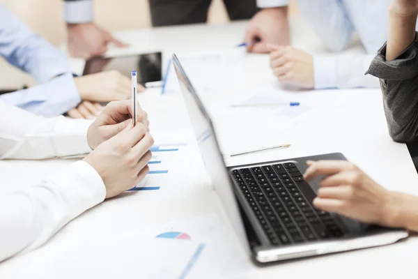 Close up of files and laptop computer in office Stock Photo