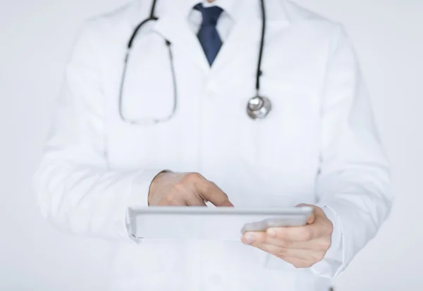 Male doctor holding tablet pc — Stock Photo, Image