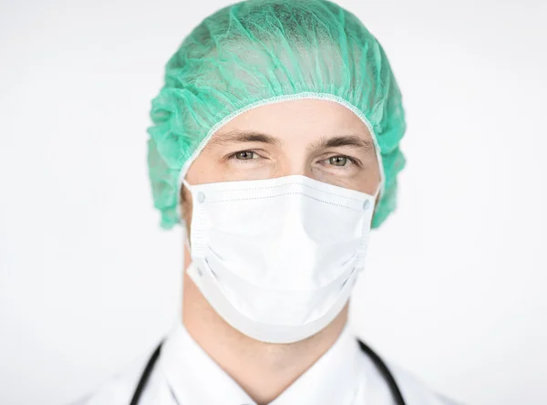 Surgeon in medical cap and mask — Stock Photo, Image