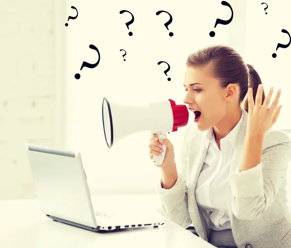 Strict businesswoman shouting in megaphone — Stock Photo, Image