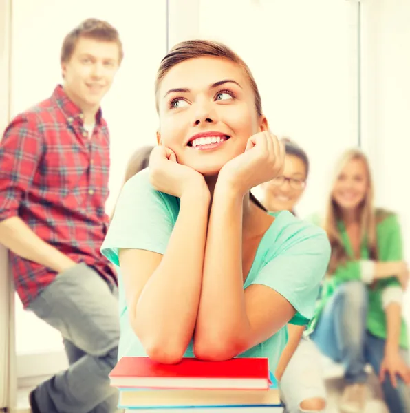 Happy smiling student girl with books at school — Stock Photo, Image