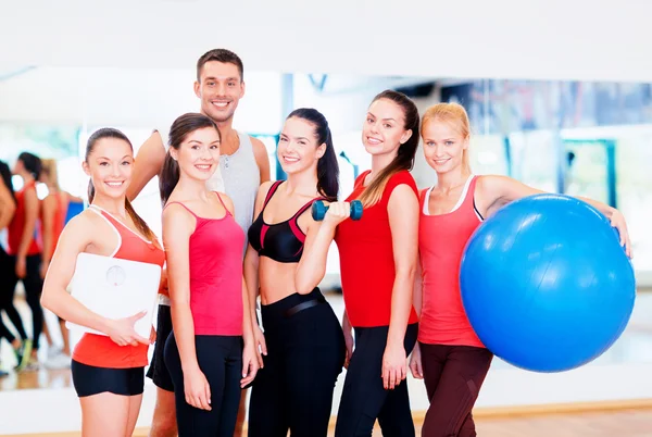 Group of smiling people in the gym Royalty Free Stock Photos