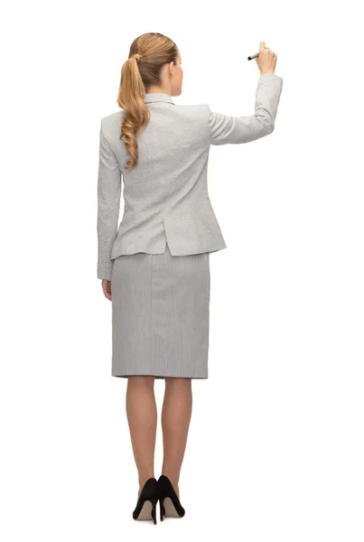 Businesswoman or teacher with marker from back — Stock Photo, Image