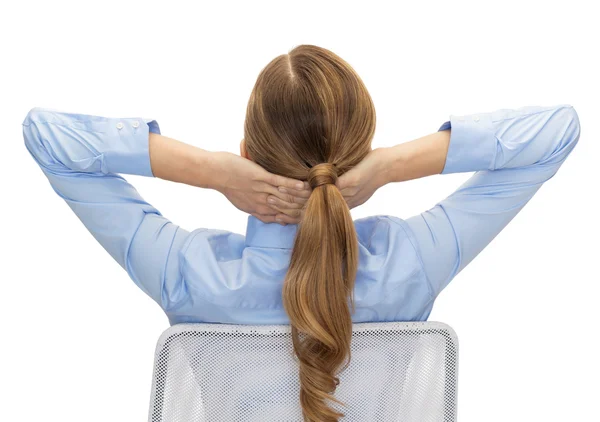 Businesswoman sitting on chair from back — Stock Photo, Image