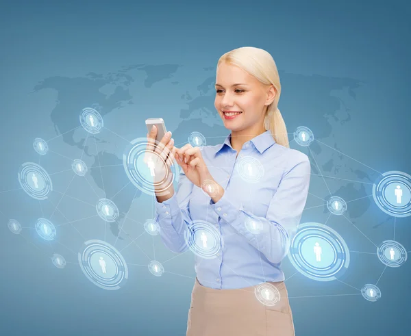 Business woman with smartphone over blue background — стоковое фото