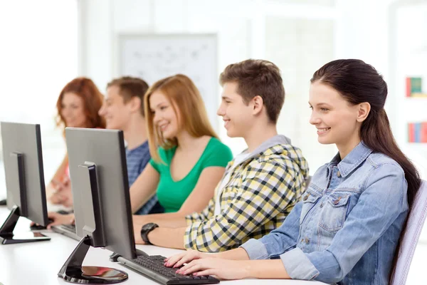 Female student with classmates in computer class — Stock Photo, Image