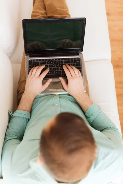 Close up of man working with laptop at home — Stock Photo, Image