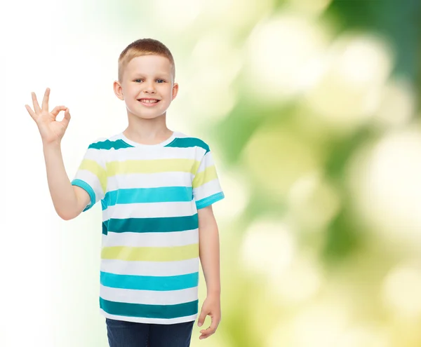 Little boy in casual clothes making OK gesture — Stock Photo, Image