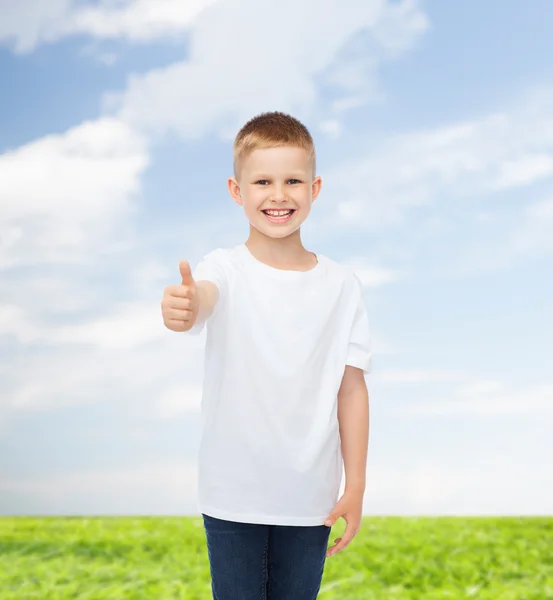 Smiling little boy in white blank t-shirt — Stock Photo, Image