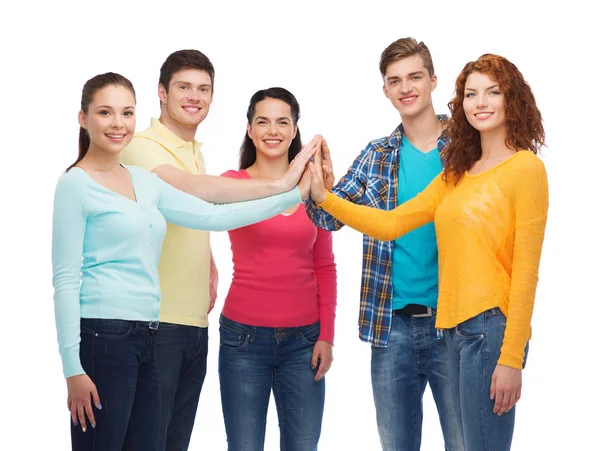 Smiling teenagers making high five — Stock Photo, Image